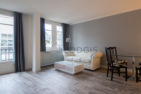Living room with windows facing the road