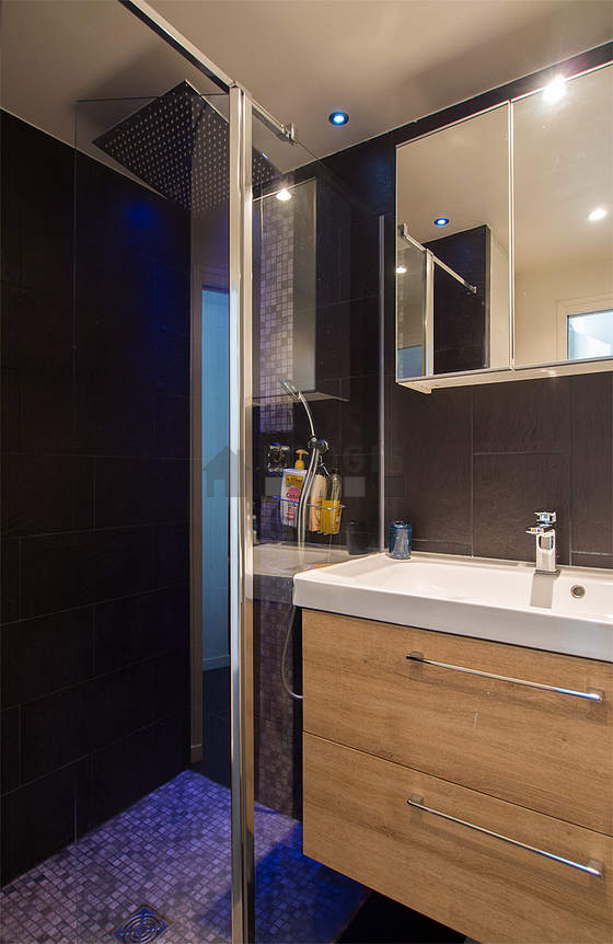 Bathroom equipped with washing machine, cupboard