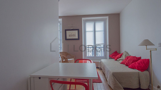 Living room with double-glazed windows facing the road