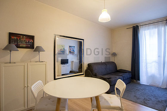 Quiet living room furnished with 1 sofabed(s) of 140cm, tv, wardrobe, cupboard