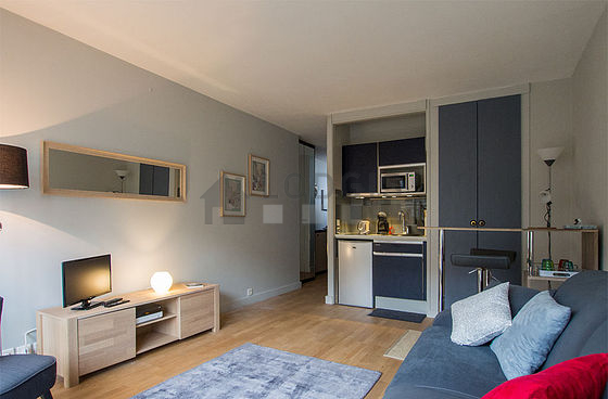 Living room with double-glazed windows and balcony facing the road