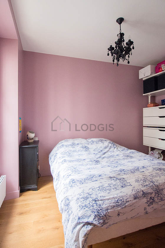 Bedroom with wooden floor