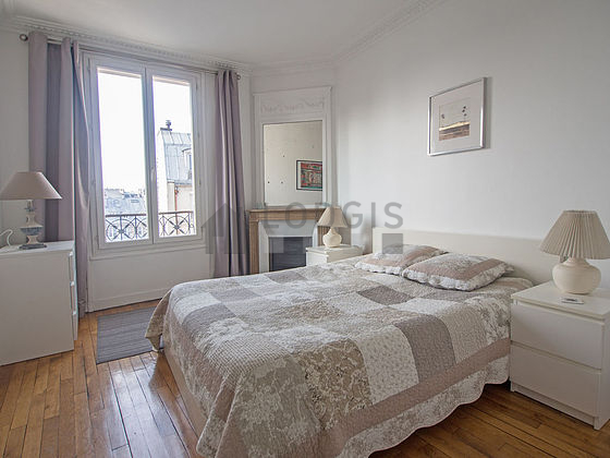 Bedroom with wooden floor