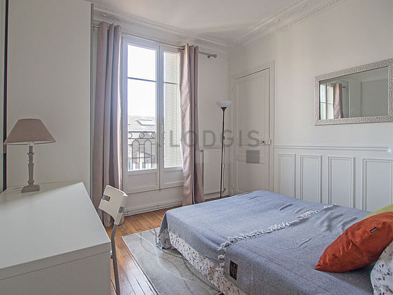 Bedroom with wooden floor