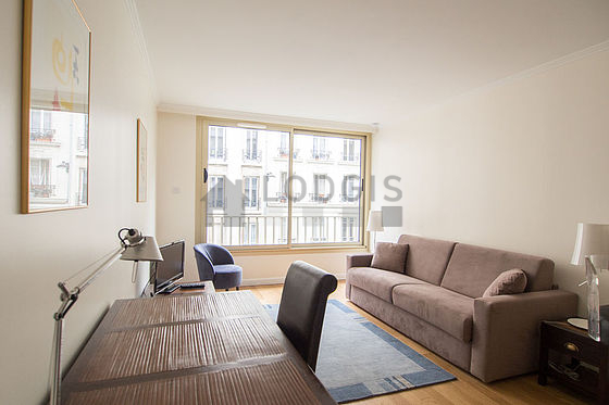 Quiet living room furnished with 1 sofabed(s) of 160cm, tv, 1 armchair(s), 1 chair(s)