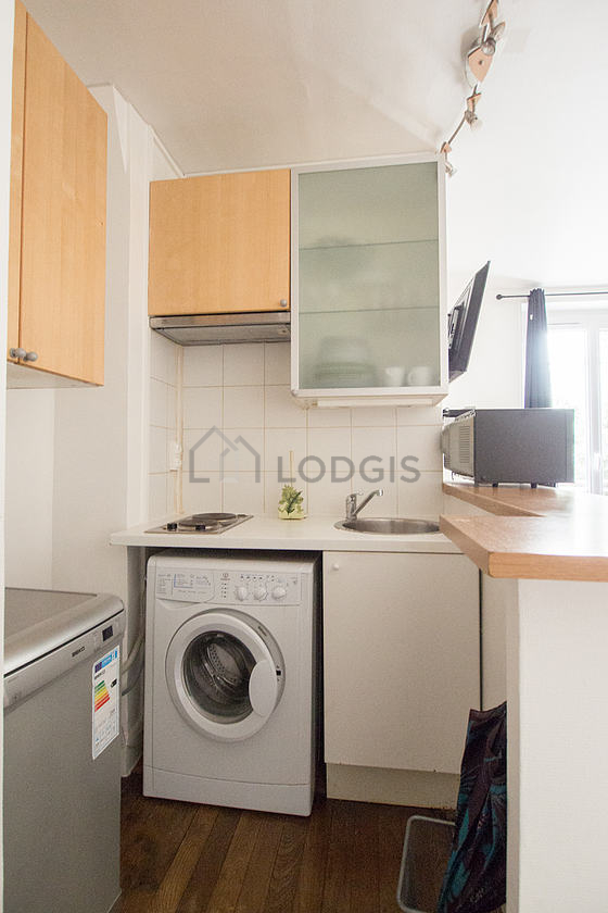 Kitchen where you can have dinner for 2 person(s) equipped with washing machine, dryer, refrigerator, extractor hood