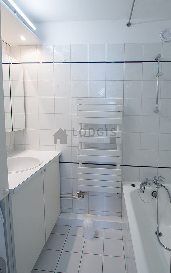 Bathroom equipped with washing machine, bath towels