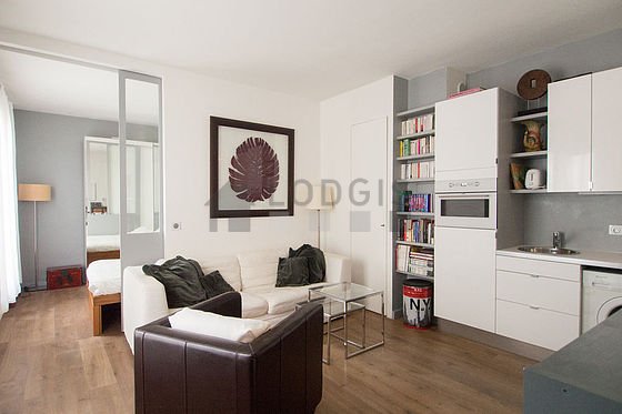 Very quiet living room furnished with tv, 1 armchair(s)