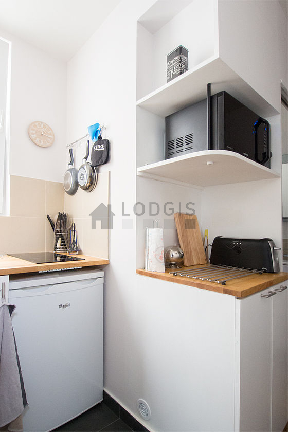 Bright kitchen with double-glazed windows facing the courtyard