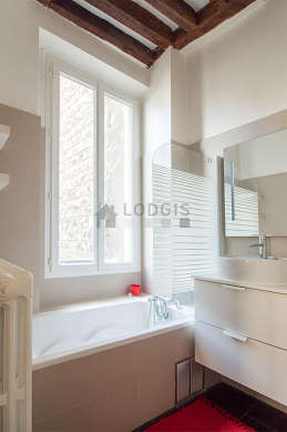 Bathroom equipped with washing machine, shelves