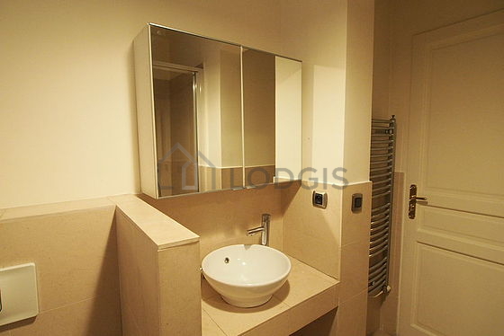 Bathroom equipped with separate shower, towel drying radiator