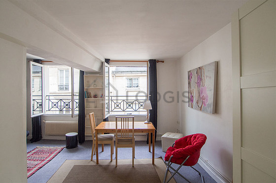 Quiet living room furnished with tv, 1 armchair(s), 2 chair(s)