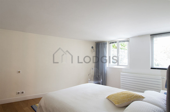 Very bright bedroom equipped with tv
