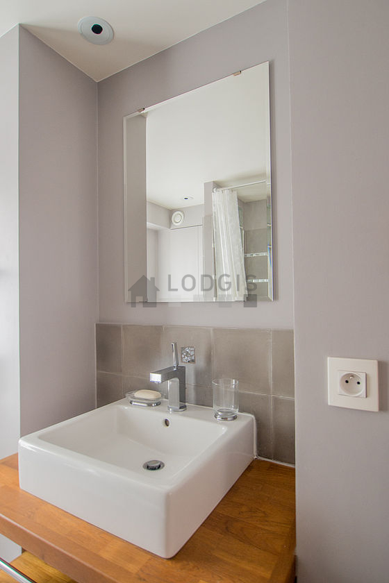 Bathroom equipped with shower in bath tub