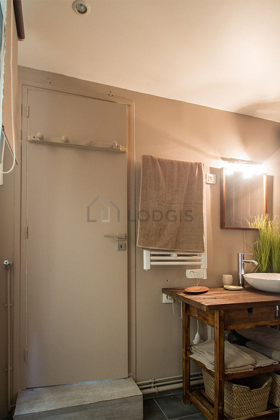 Bathroom equipped with washing machine, bath towels