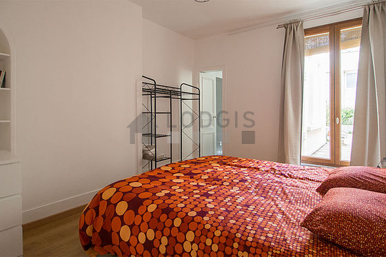 Bedroom equipped with storage space, cupboard, bedside table
