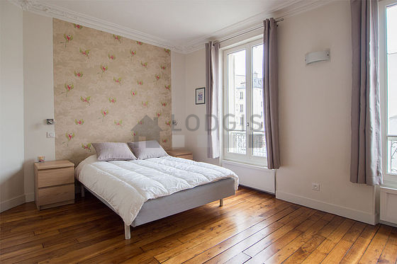 Bedroom with wooden floor