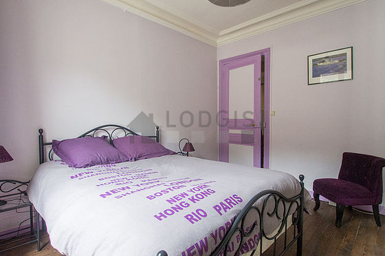 Bright bedroom equipped with 1 armchair(s), stool