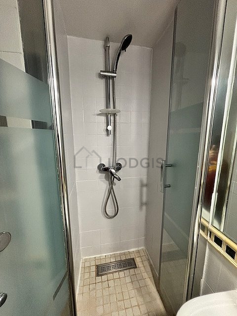 Bathroom equipped with washing machine, bath towels