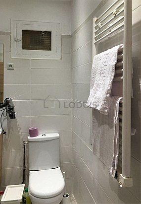 Bathroom equipped with washing machine, bath towels