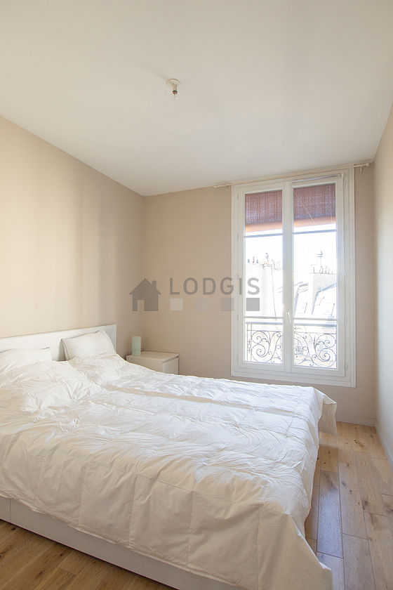 Chambre de 12m² avec du parquet au sol