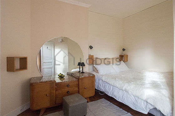 Bedroom with windows facing the road