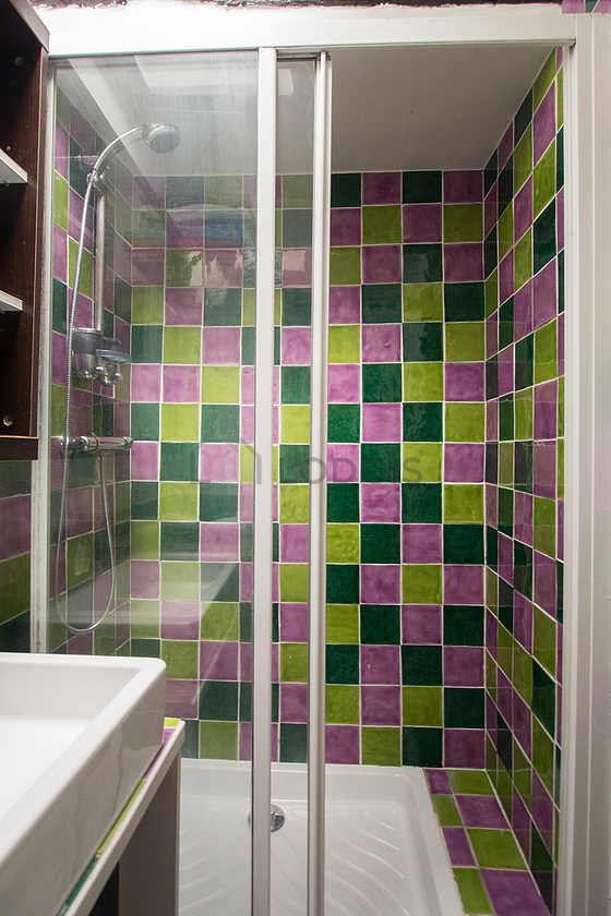 Bathroom equipped with washing machine, bath towels