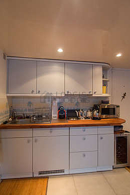 Beautiful kitchenopens on the dining room with tile floor
