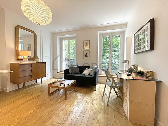 Very quiet living room furnished with tv, 2 armchair(s), 2 chair(s)