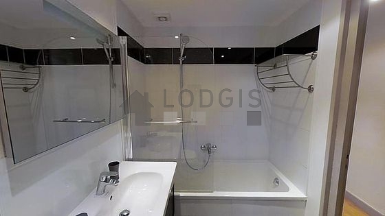 Pleasant and very bright bathroom with tile floor