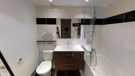 Pleasant and very bright bathroom with tile floor