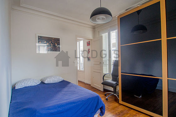 Bedroom with wooden floor
