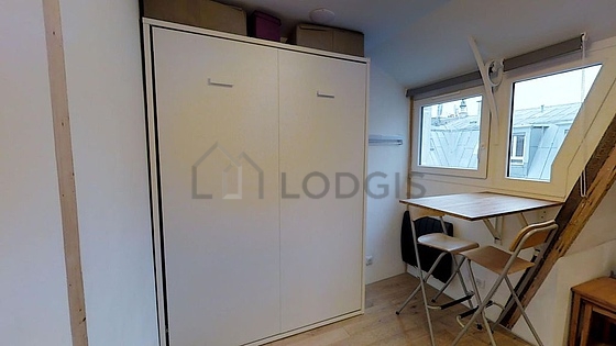 Quiet living room furnished with 1 murphy bed(s) of 140cm, tv, hi-fi stereo, fan