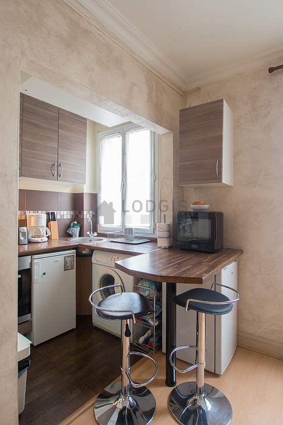 Kitchen where you can have dinner for 2 person(s) equipped with washing machine, refrigerator, freezer, extractor hood