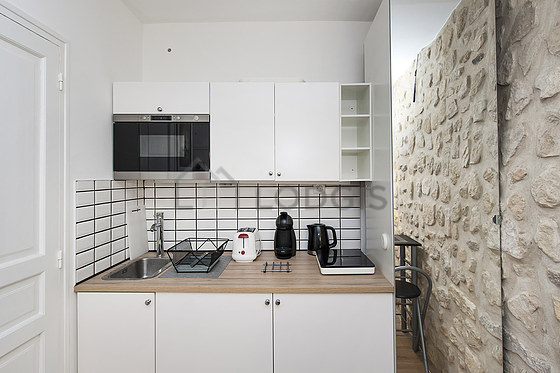 Great kitchenopens on the living room with wooden floor