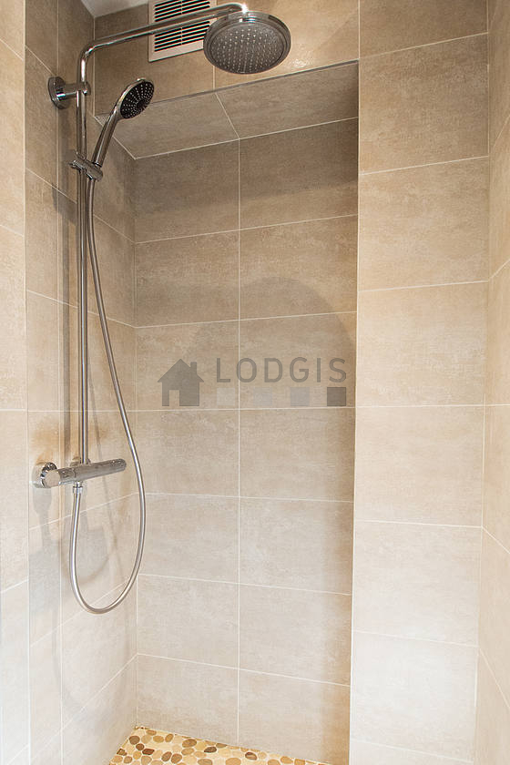 Bathroom equipped with separate shower, towel drying radiator