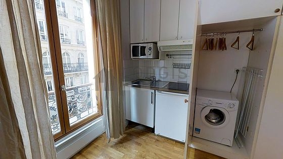 Beautiful kitchen of 2m²opens on the living room with wooden floor