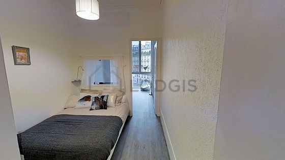 Bedroom with wooden floor