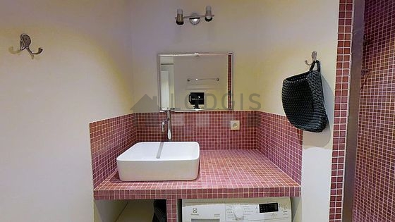 Bathroom equipped with washing machine, bath towels