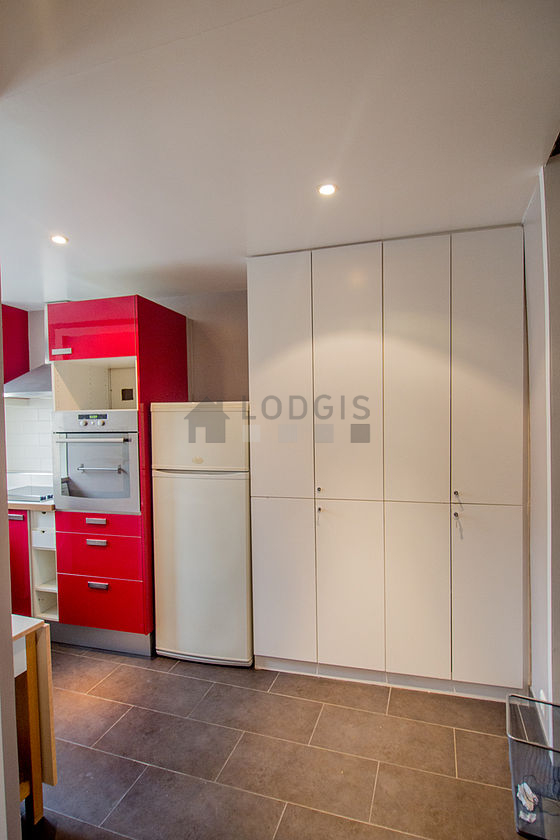 Bright kitchen with double-glazed windows facing the courtyard