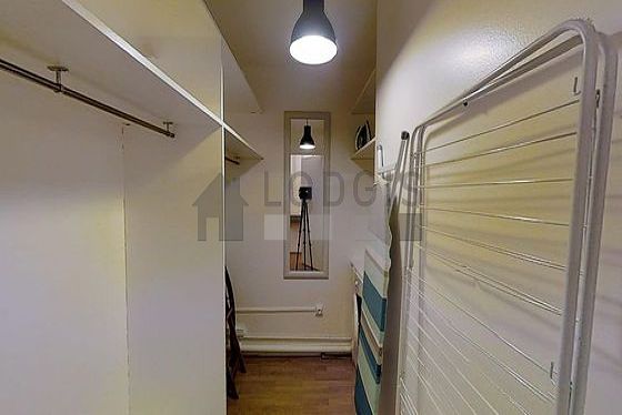 Very beautiful laundry room with woodenfloor and equipped with washing machine, 2 chair(s)