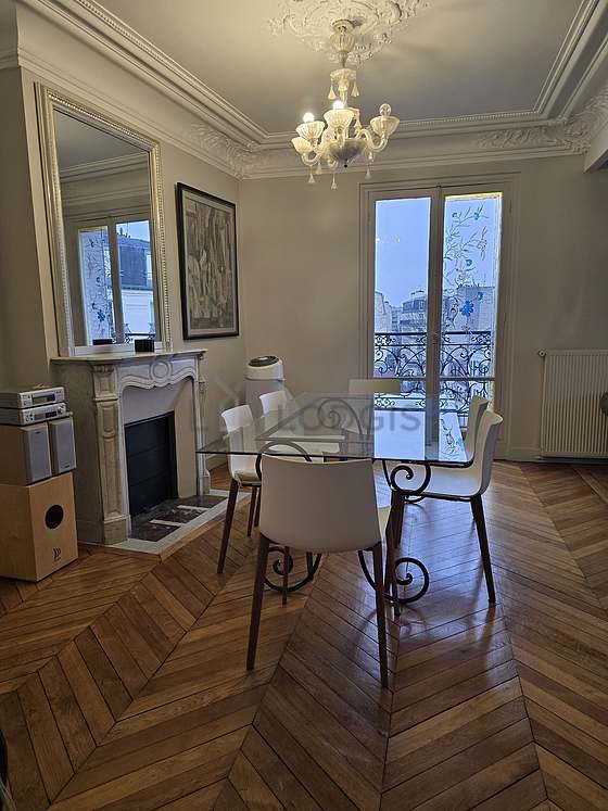 Dining room equipped with dining table, fireplace