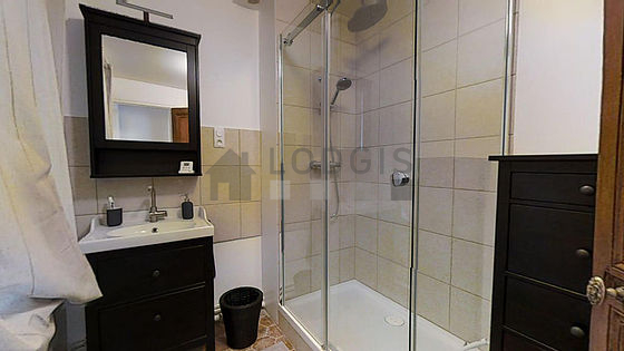 Bathroom equipped with washing machine, bath towels