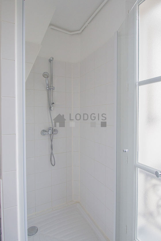 Bathroom equipped with washing machine, bath towels