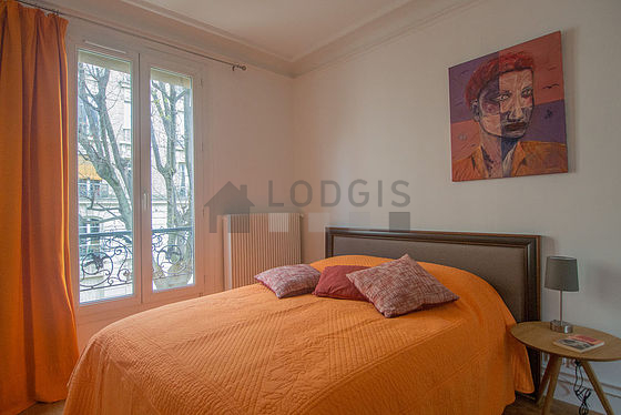 Bedroom with double-glazed windows facing the garden