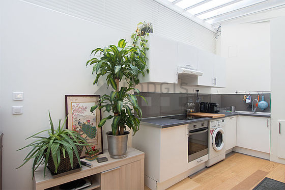 Great kitchenopens on the living room with wooden floor