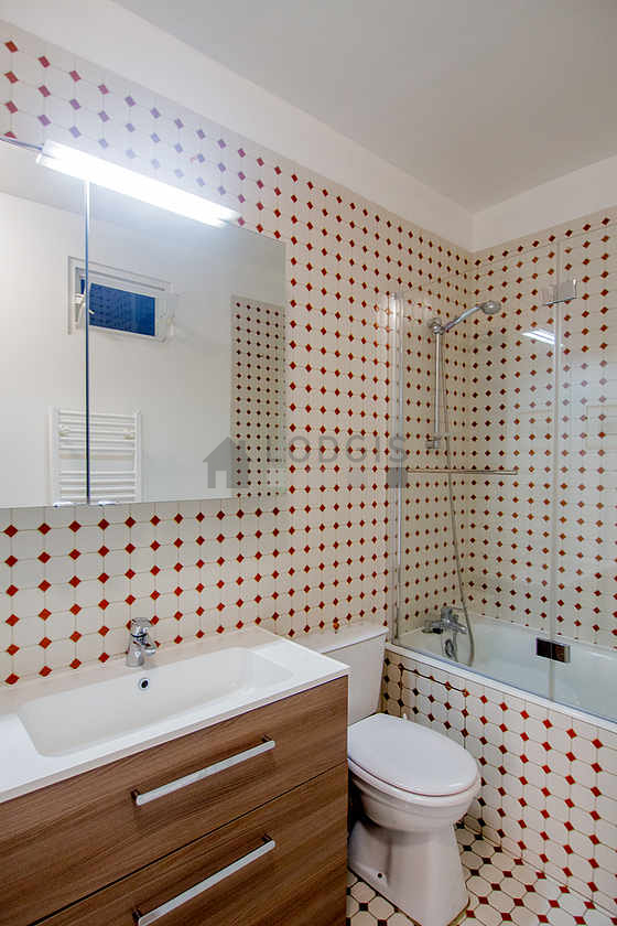 Bathroom equipped with washing machine, bath towels