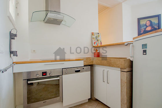 Kitchen equipped with dishwasher, hob, refrigerator, freezer