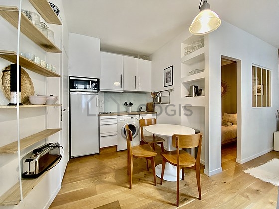 Kitchen where you can have dinner for 3 person(s) equipped with washing machine, dryer, refrigerator, extractor hood