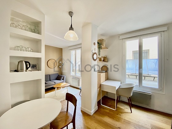 Quiet living room furnished with tv, 1 armchair(s)